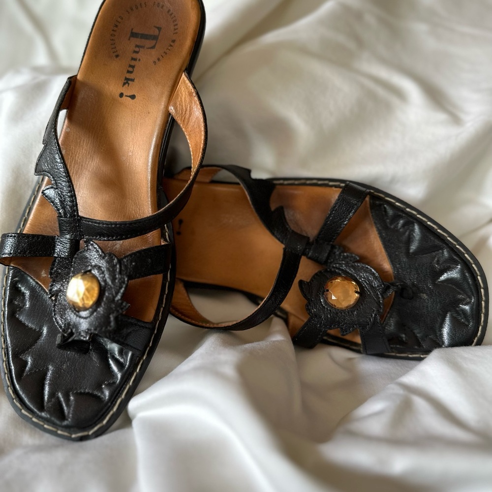 THINK! brand black leather sandals with amber colored gem accent